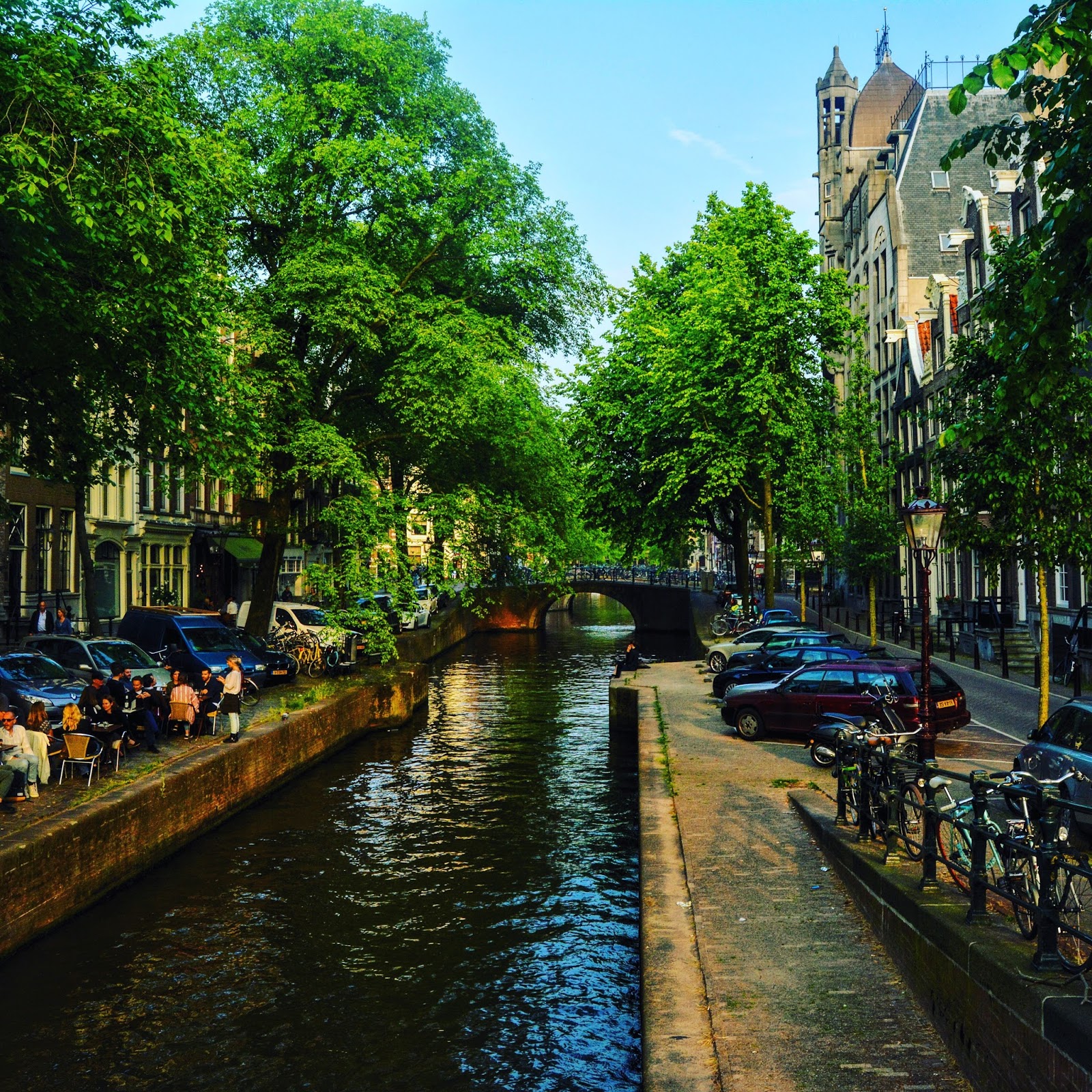 A photo of the canals in Amsterdam flanked by a restaurant on one side from the post 'planning a Europe Trip from India'