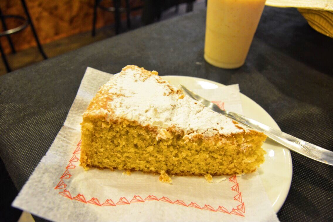 A photo of almond cake and milk found in Valldemoosa, Spain