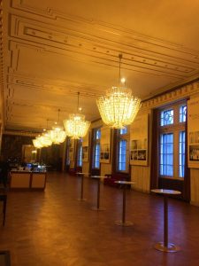 Many Chandeliers inside a hall inside the Vienna Opera House