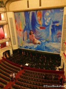 This is a photo of the big hall in Vienna Opera House, Austria. The entire decor is in red