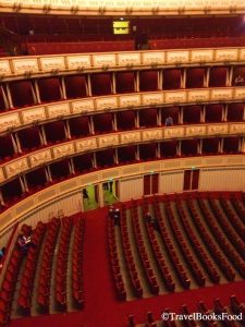 This is a photo of the big hall in Vienna Opera House, Austria. The entire decor is in red