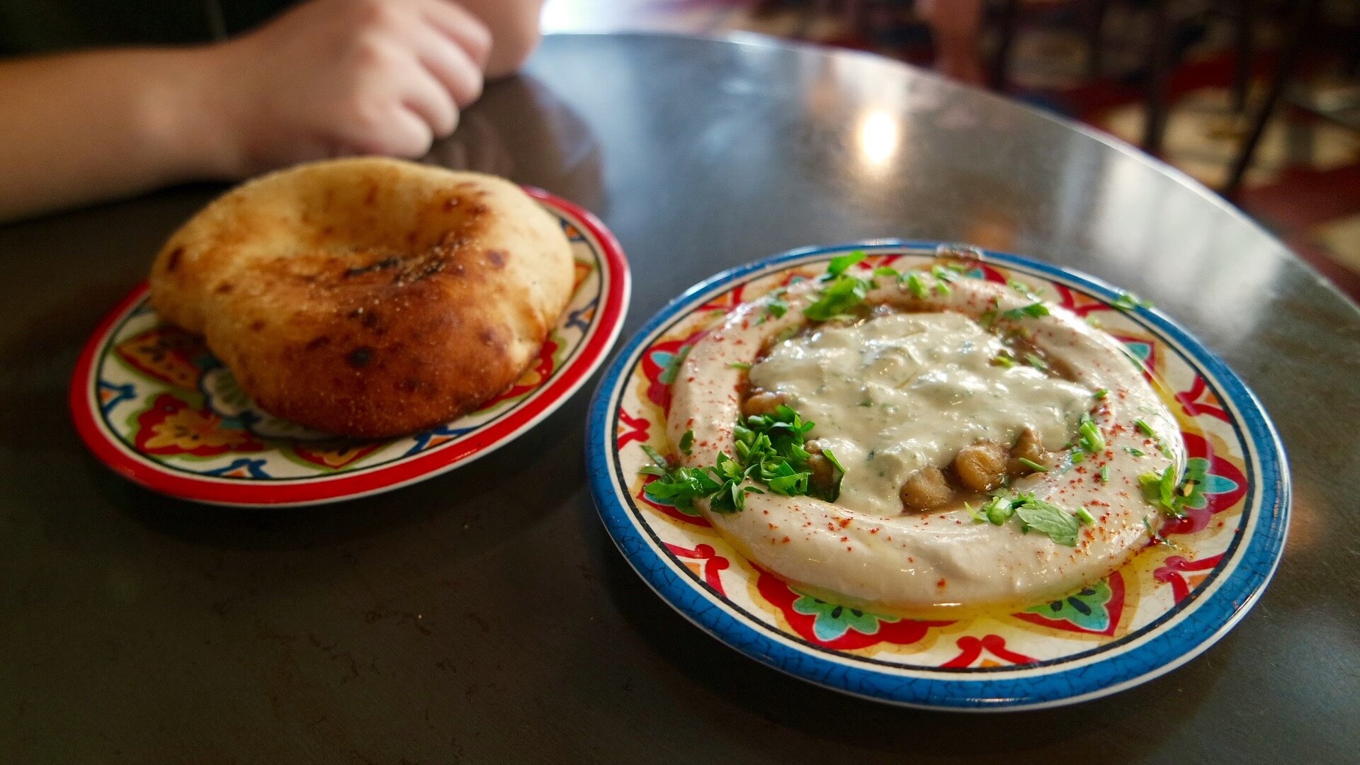 A photo of an Israeli food combination of Hummus and Pita