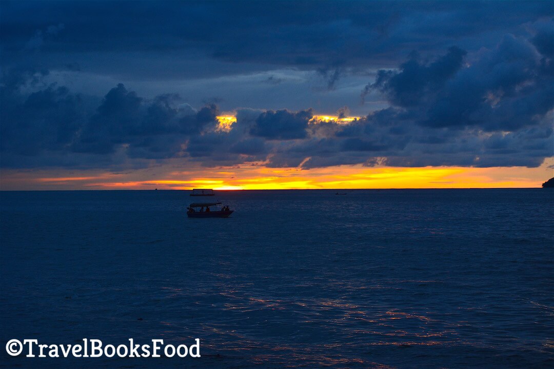 A gorgeous sunset in Kota Kinabalu. You can see a boat in the distance