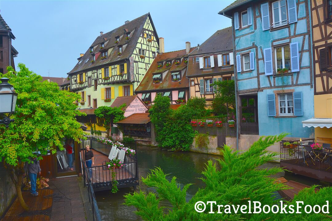 In this town, you will find the town of Colmar with its colourful timbered houses with a water body in front of it