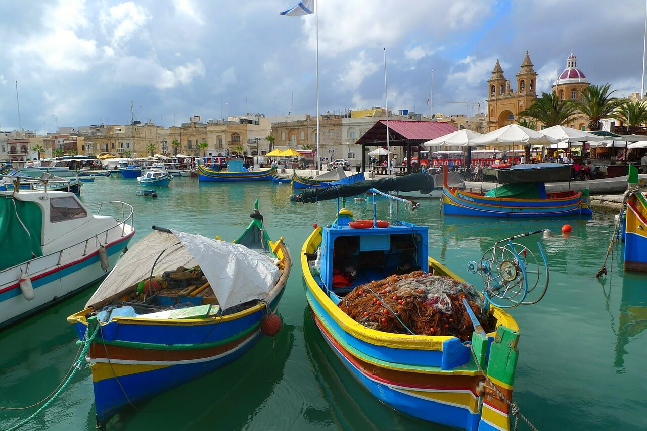 A colorful marina filled with lots of colourful boats in Malta