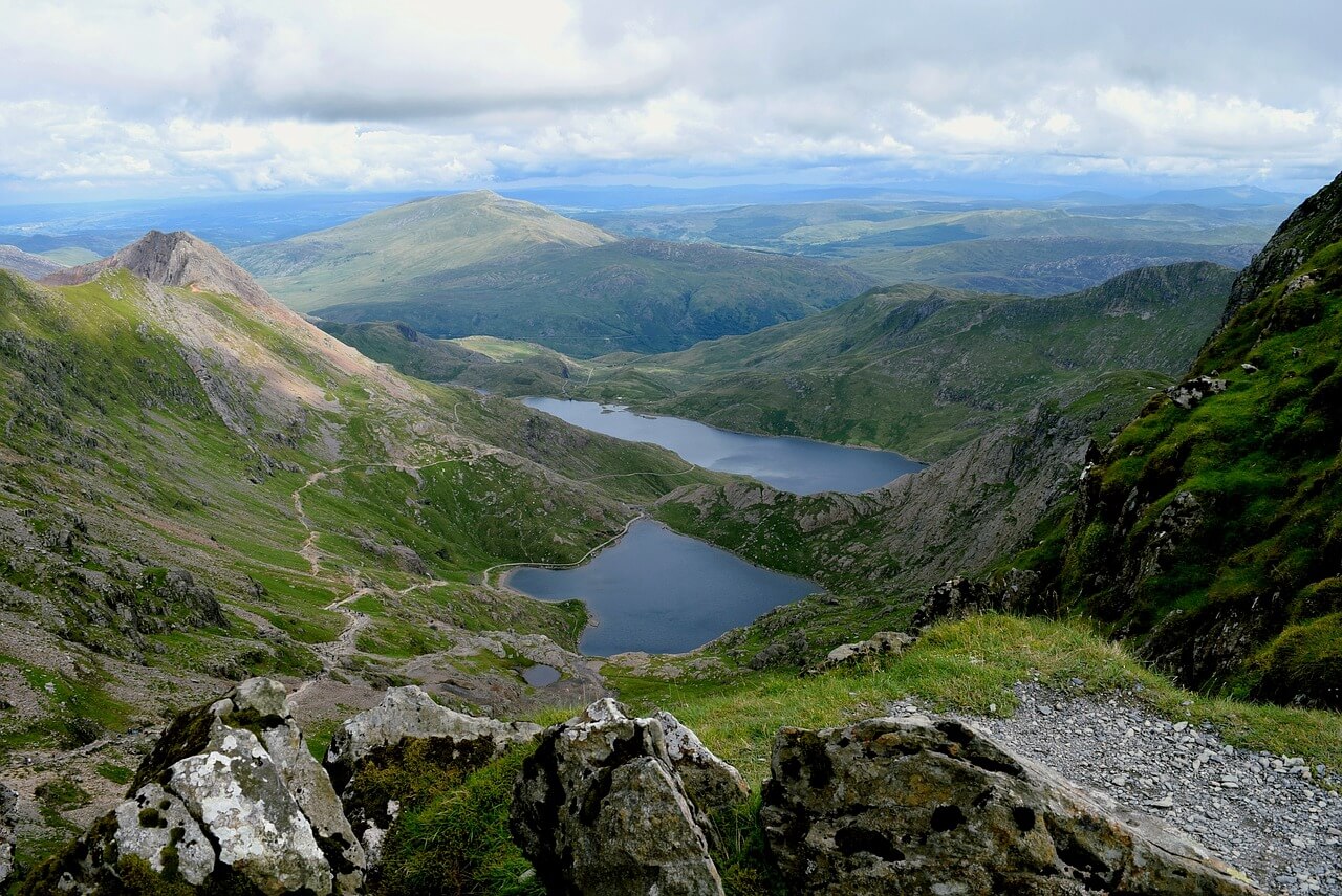 This is the photo of a green valley with two lakes between them in Wales