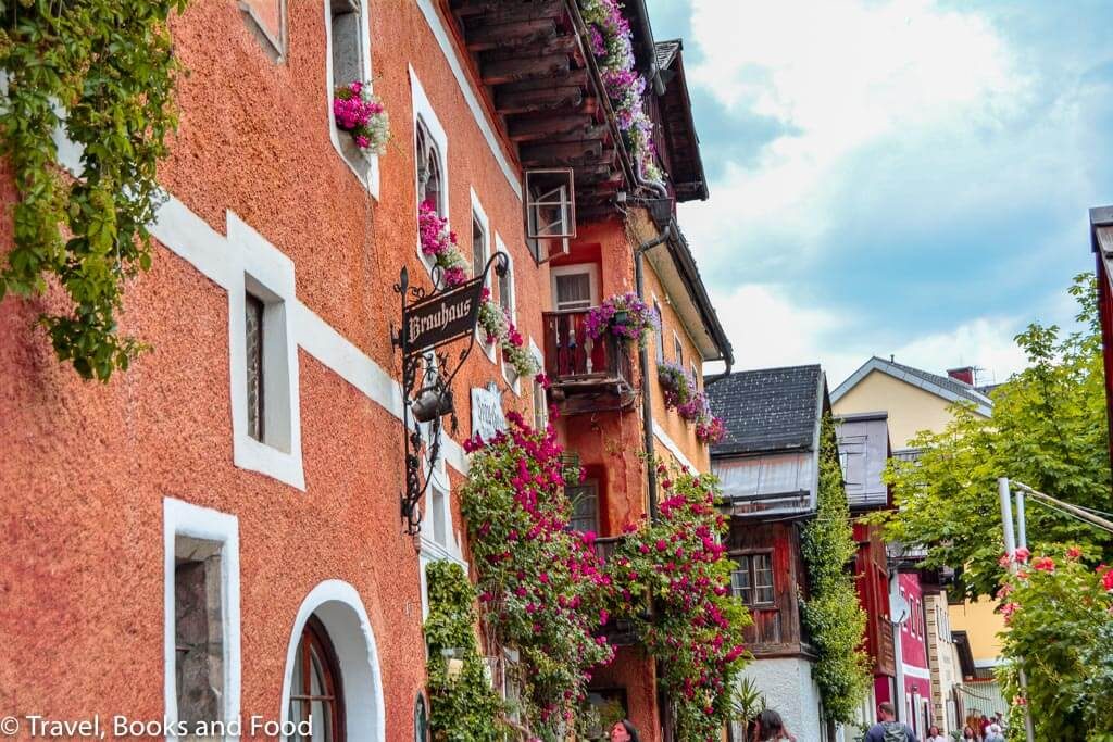Hallstatt village in the Austrian alps full of colourful houses and lots of flower boxes