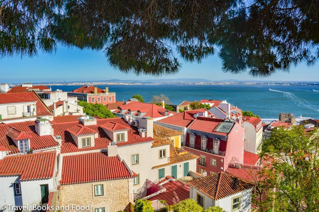 A view of Lisbon from top of San Jorge Castle with lots of brown tiled houses
