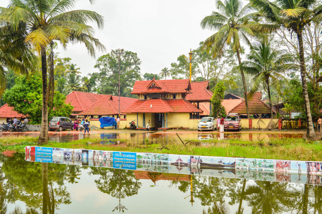 A temple with a red roof in Kerala: Human by Nature in Kerala