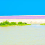 Start Here - A colorful photo with blue sky, white sand, green and pink waters from Mexico